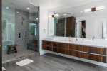 En Suite Master Bath Features Floating Double Sink Vanity, Duel Shower Head, Duel Hand shower